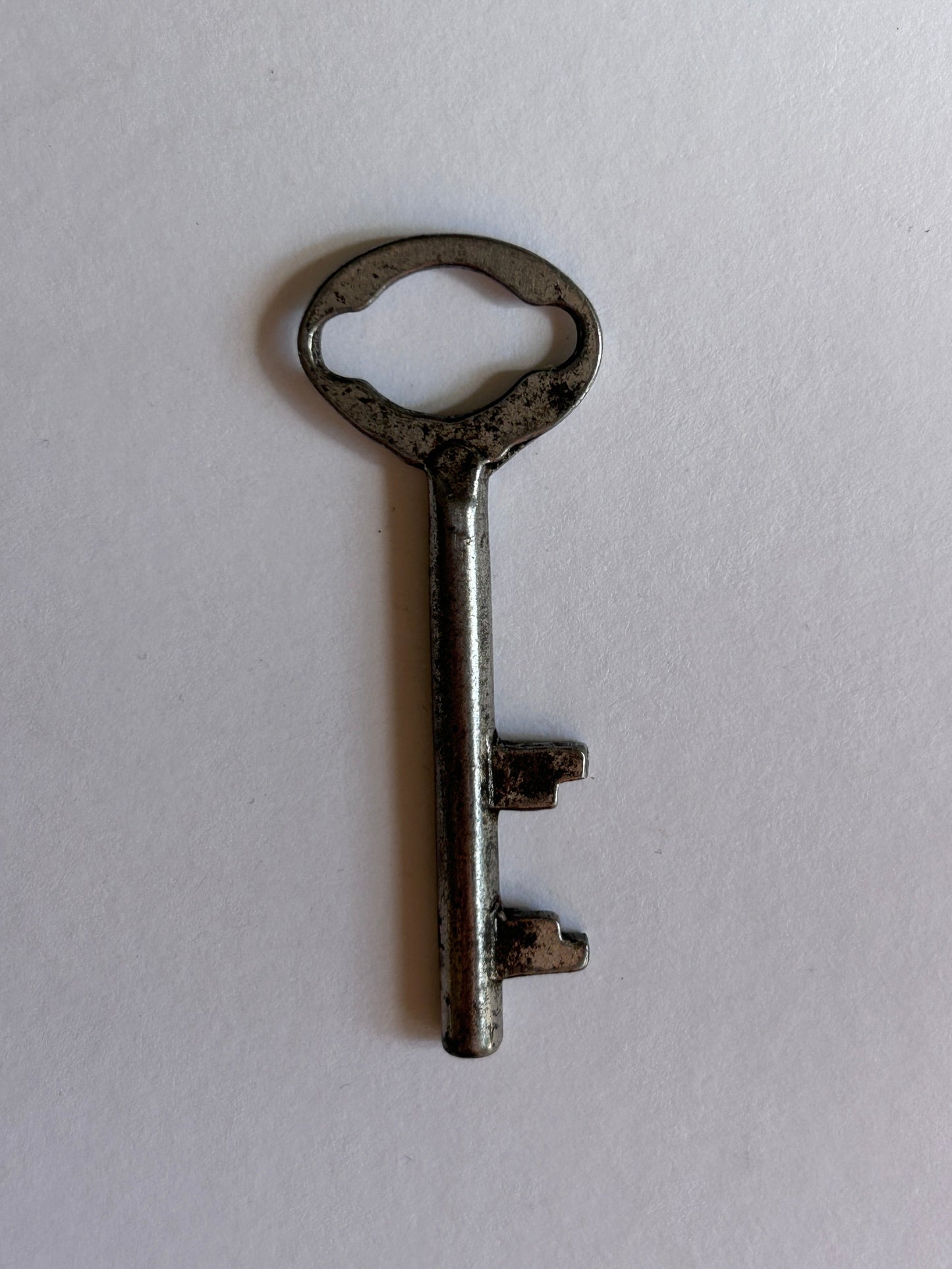 Vintage key on a white background